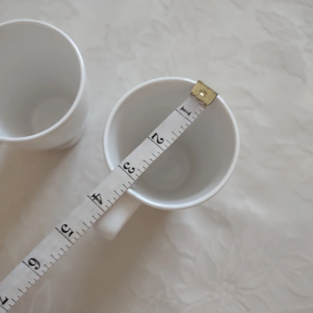 2 white tall cups mugs IKEA Sweden coffee tea